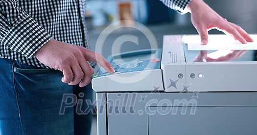 assistant makes copies of files in the copy machine assistant makes copies of files in the copy machine