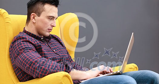 Young Entrepreneur Freelancer Working Using A Laptop And In Coworking space Young Entrepreneur Freelancer Working Using A Laptop And In Coworking space