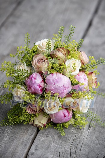 Bouquet of roses on grey wooden planks Bouquet of roses on grey wooden planks
