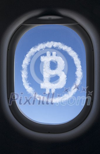 Icon bitcoin made of clouds against the blue sky in the airplane window. Travel world wide business concept. Icon bitcoin made of clouds against the blue sky in the airplane window. Travel world wide business concept.