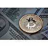 Dollar bills and gold coin bitcoin. Cryptocurrency business concept. Conceptual image for worldwide cryptocurrency and digital payment system.