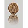 Gold Bitcoin Coin on a gray background. Reflection of the back side of the coin on a glossy background. Bitcoin cryptocurrency. Business concept.