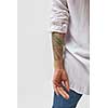 Back view of standing young woman with tattoo on hands. Isolated on gray background.