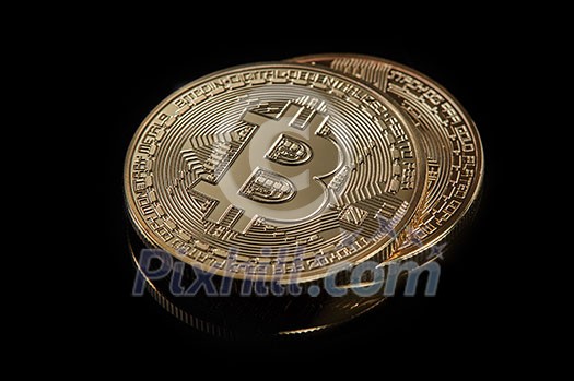 Stacked bitcoin BTC cryptocurrency. BTC golden coins as symbol of electronic virtual money for web banking and international network payment on a black background Stacked bitcoin BTC cryptocurrency. BTC golden coins as symbol of electronic virtual money for web banking and international network payment on a black background