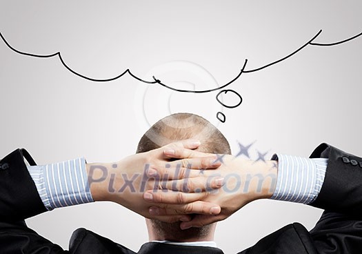 Rear view of businessman looking up thoughtfully Rear view of businessman looking up thoughtfully