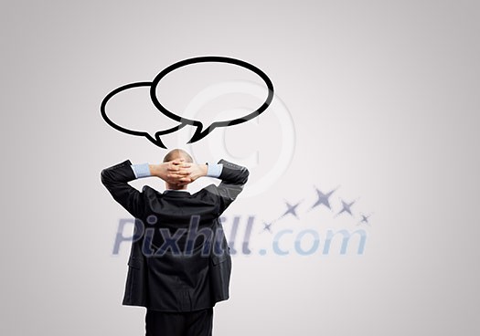 Rear view of businessman looking up thoughtfully Rear view of businessman looking up thoughtfully