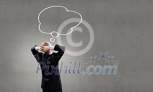 Rear view of businessman looking up thoughtfully Rear view of businessman looking up thoughtfully