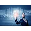 Attractive businesswoman touching icon of media screen