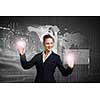 Attractive businesswoman touching icon of media screen