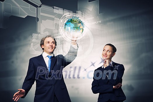 Businessman and businesswoman touching icon of digital screen. Elements of this image are furnished by NASA