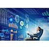 Young businessman with tablet in hands against digital background