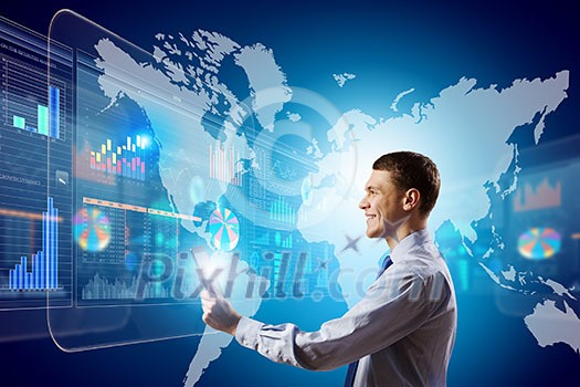 Young businessman with tablet in hands against digital background Young businessman with tablet in hands against digital background