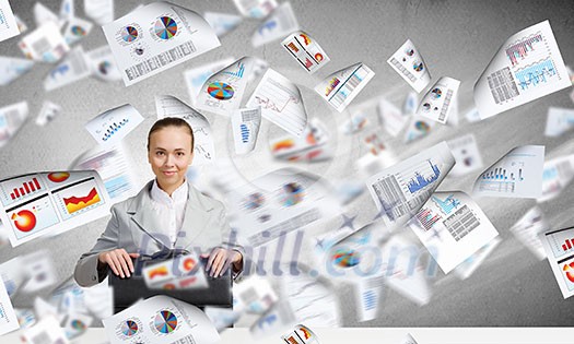 Young pretty businesswoman sitting with briefcase in hands Young pretty businesswoman sitting with briefcase in hands