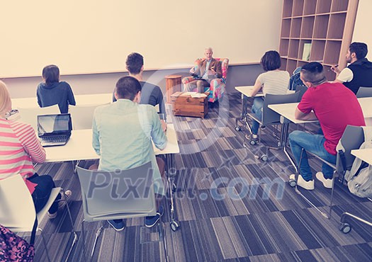 group of students study with professor in modern school classroom group of students study with professor in modern school classroom