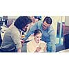 Group of a young business people discussing business plan at modern startup office building