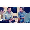 Group of a young business people discussing business plan at modern startup office building