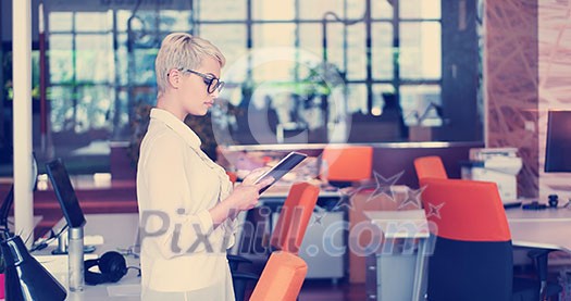 Businesswoman using tablet at the work in office Businesswoman using tablet at the work in office