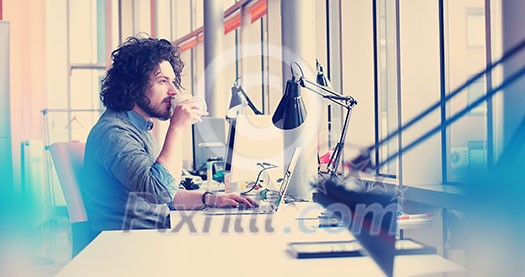 Young Entrepreneur Freelancer Working Using A Laptop In Coworking space Young Entrepreneur Freelancer Working Using A Laptop In Coworking space