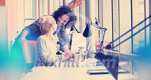 two business people using laptop preparing for next meeting and discussing ideas two business people using laptop preparing for next meeting and discussing ideas