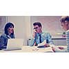 Group of a young business people discussing business plan at modern startup office building