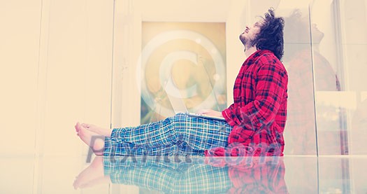 Real man Using laptop on the floor At Home Enjoying Relaxing Real man Using laptop on the floor At Home Enjoying Relaxing