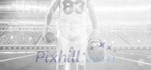 Closeup Portrait of a strong muscular American Football Player on big modern stadium field with lights and flares Closeup Portrait of a strong muscular American Football Player on big modern stadium field with lights and flares