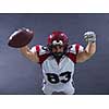 american football player celebrating touchdown isolated on gray background