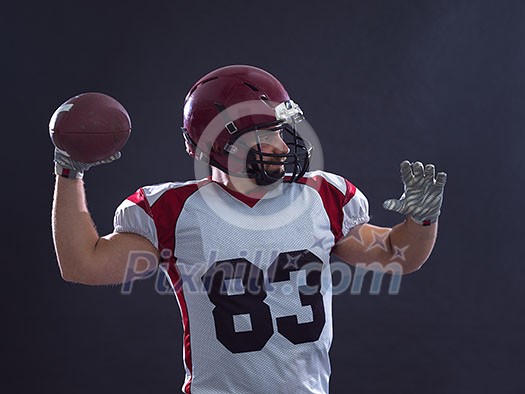 one quarterback american football player throwing ball isolated on gray background one quarterback american football player throwing ball isolated on gray background