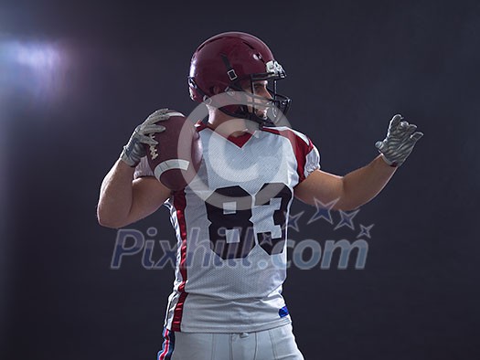 one quarterback american football player throwing ball isolated on gray background one quarterback american football player throwing ball isolated on gray background