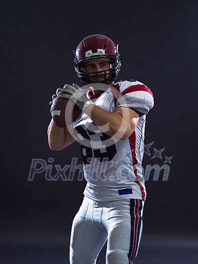 one quarterback american football player throwing ball isolated on gray background one quarterback american football player throwing ball isolated on gray background