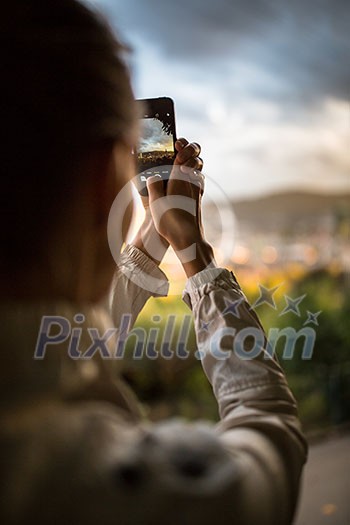 Travel & Discovery - female tourist taking photos of a city while traveling Travel & Discovery - female tourist taking photos of a city while traveling
