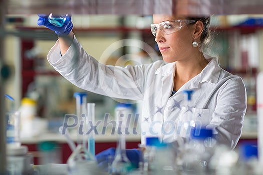 Female researcher carrying out scientific research in a lab (shallow DOF; color toned image) Female researcher carrying out scientific research in a lab (shallow DOF; color toned image)