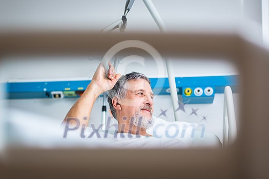 Senior male patient in a modern hospital (shallow DOF; color toned image) Senior male patient in a modern hospital (shallow DOF; color toned image)
