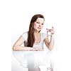 Closeup portrait of a young attractive woman drinking water from glass.