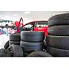 Inside a garage - changing wheels/tires (shallow DOF; color toned image)