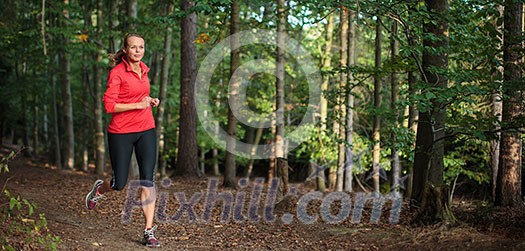 Young woman running outdoors in a forest, going fast (motion blurred image) Young woman running outdoors in a forest, going fast (motion blurred image)