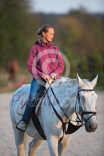 Horseback rider, woman riding a horse Horseback rider, woman riding a horse