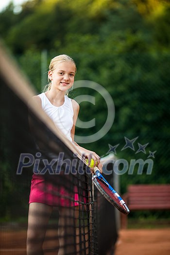 Young, teen tennis player on court Young, teen tennis player on court