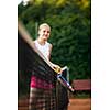 Young, teen tennis player on court
