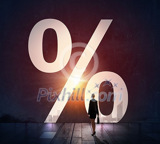 Businesswoman with suitcase in light of percentage door way Businesswoman with suitcase in light of percentage door way