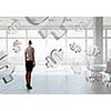Elegant businesswoman in modern office interior against window panoramic view