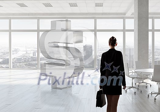 Elegant businesswoman in modern office interior against window panoramic view Elegant businesswoman in modern office interior against window panoramic view