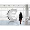 Elegant businesswoman in modern office interior against window panoramic view