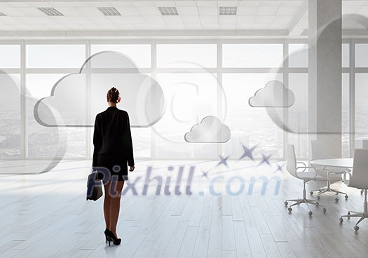 Elegant businesswoman in modern office interior against window panoramic view Elegant businesswoman in modern office interior against window panoramic view