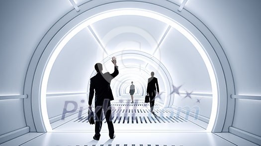 Businessman standing in virtual designed tunnel room Businessman standing in virtual designed tunnel room