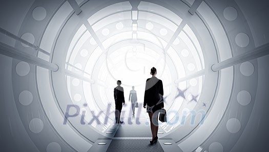 Businesswoman standing in virtual designed tunnel room Businesswoman standing in virtual designed tunnel room