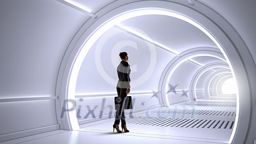 Businesswoman standing in virtual designed tunnel room Businesswoman standing in virtual designed tunnel room
