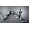 Businessman with suitcase standing on stone staircase