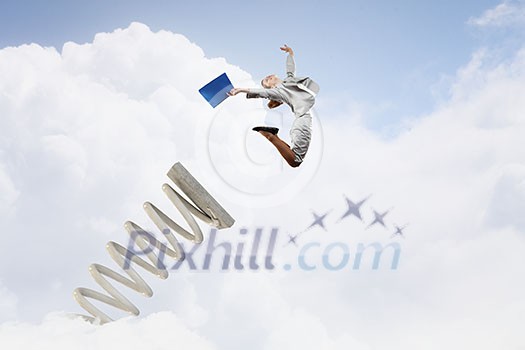 Businesswoman jumping on springboard as progress concept Businesswoman jumping on springboard as progress concept