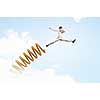 Businessman jumping on springboard as progress concept